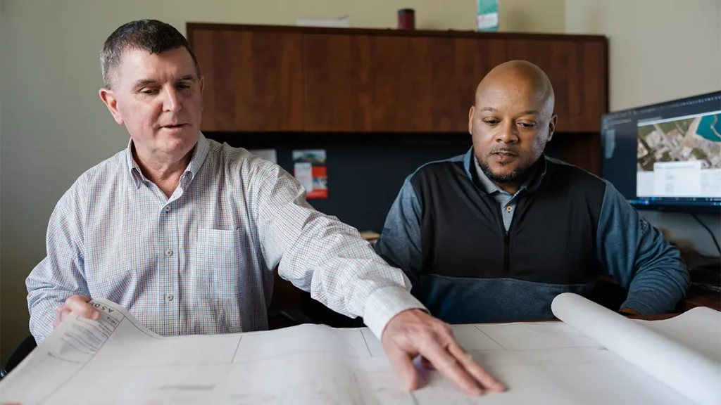two employees going over work plans