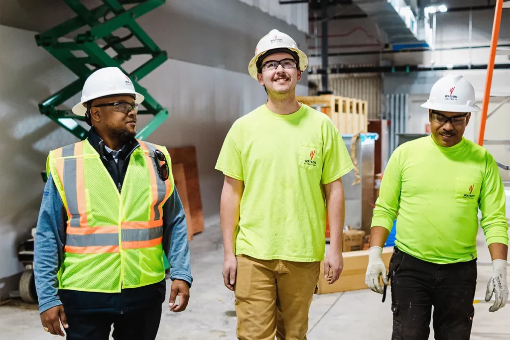 3 watson employees walking through jobsite