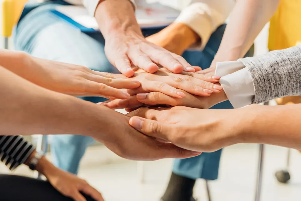 hands piled on top of one another